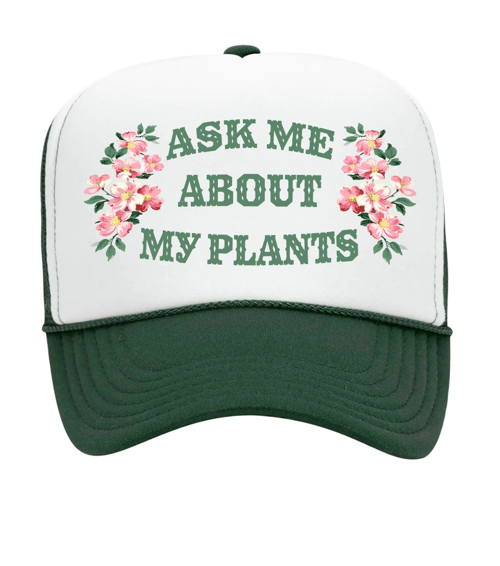 Trucker hat with 'Ask Me About My Plants' text and floral designs on a white background