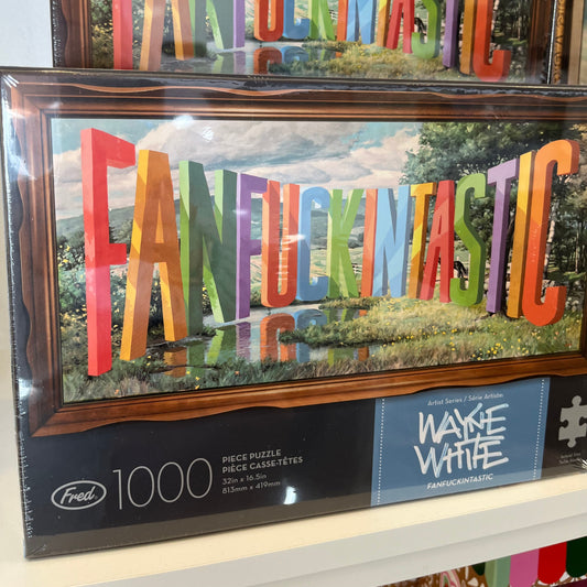 Framed colorful puzzle with Fanfuckingtastic text and a box labeled Wayne White in the background.