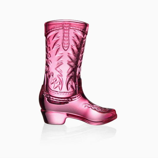 Pink glass boot with embossed design on a white background