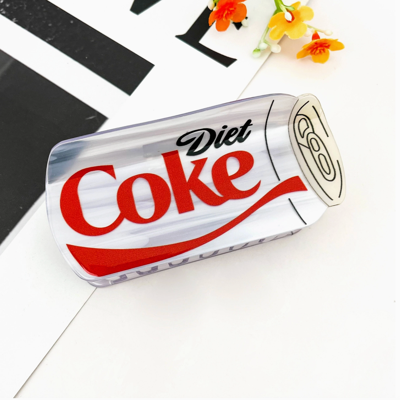 Diet Coke can-shaped hair claw on a white background