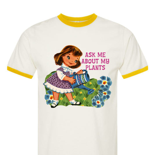 White t-shirt with a graphic of a girl and flowers, and text 'Ask me about my plants'.
