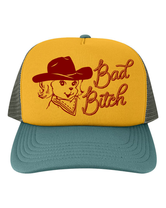 Yellow and green trucker hat with a dog graphic and “Bad Bitch” text on a yellow background