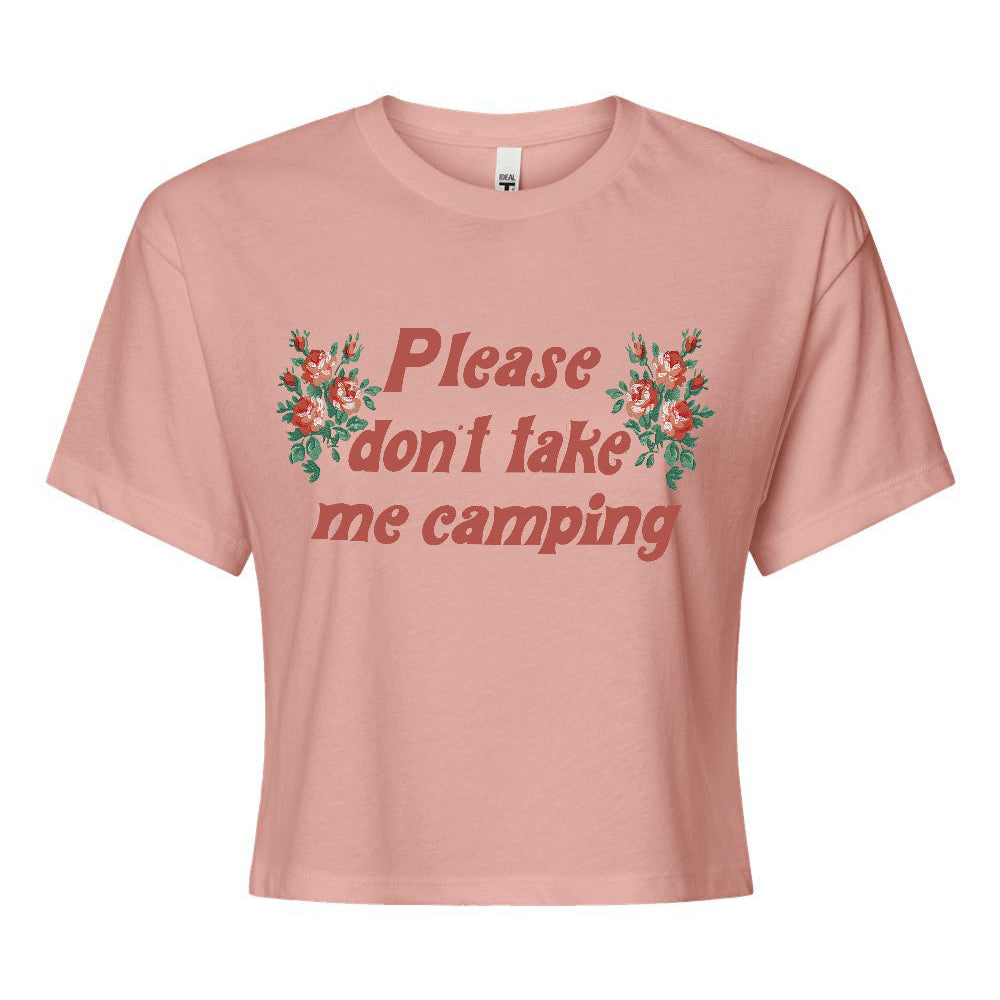 A pink crop top with the text 'Please don't take me camping' printed on the front, decorated with a floral pattern.