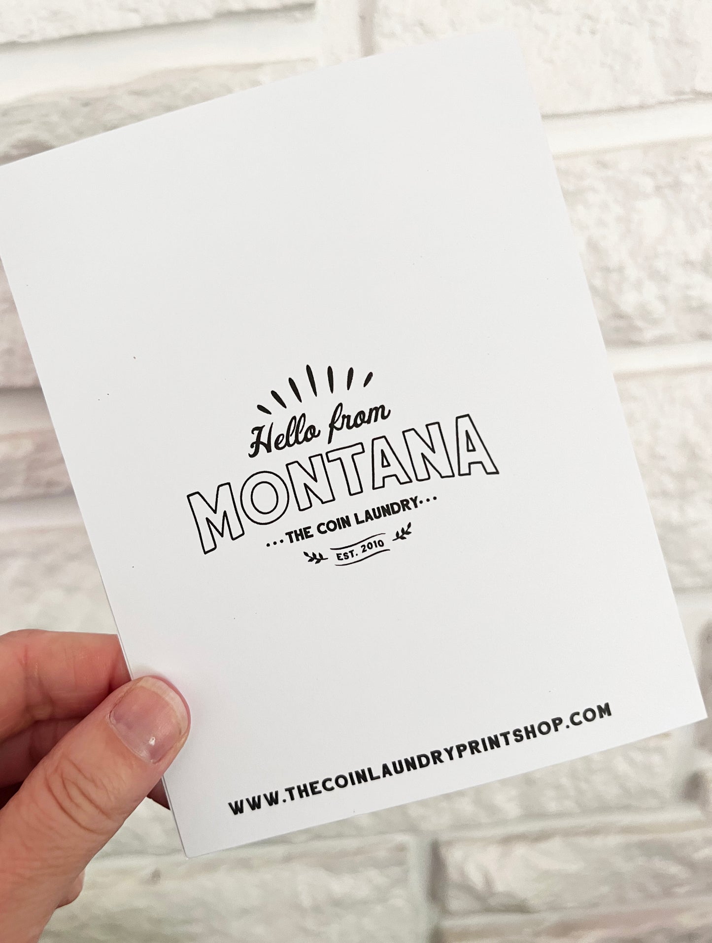 Back of card that says “Hello from Montana” 