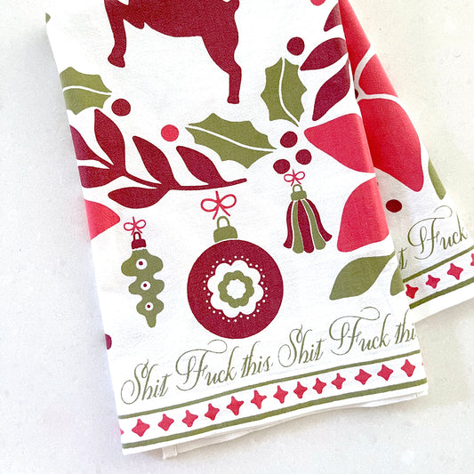 Kitchen towel with christmas ornaments and festive deer and text says 'fuck this shit'
