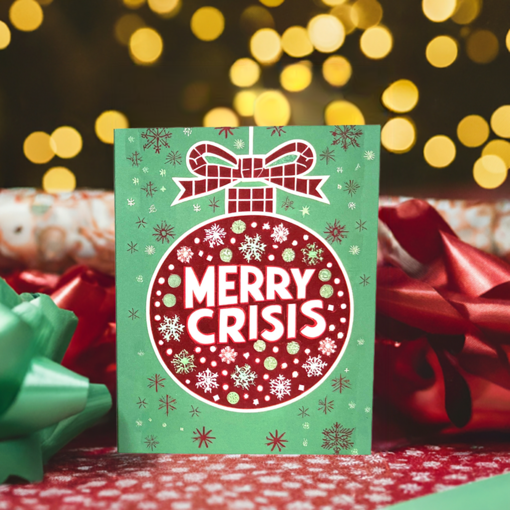 Red ornament on a green background with “Merry Crisis” text and snowflakes.
