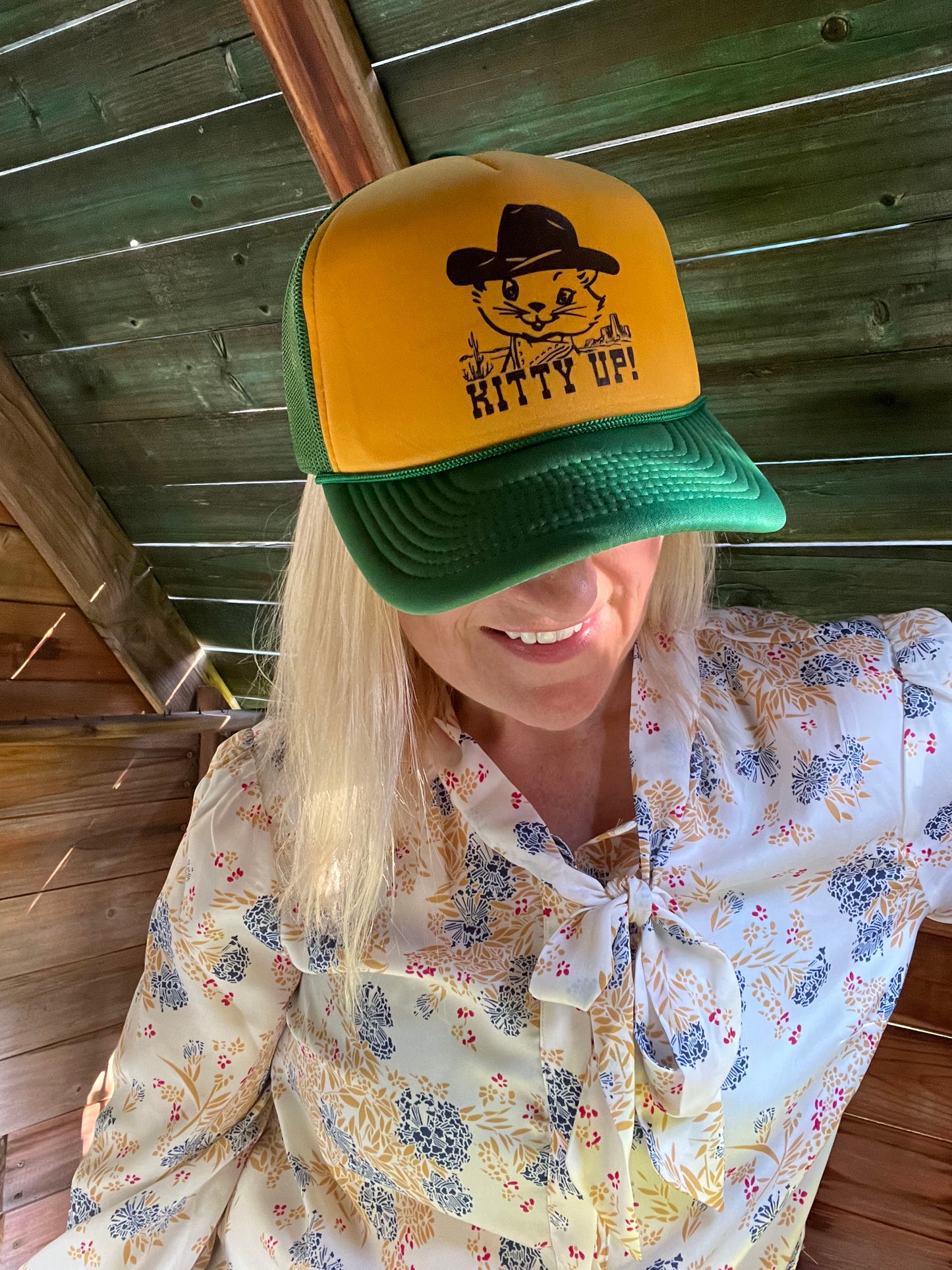 Yellow and green cap with a cat graphic and 'Kitty Up!' text