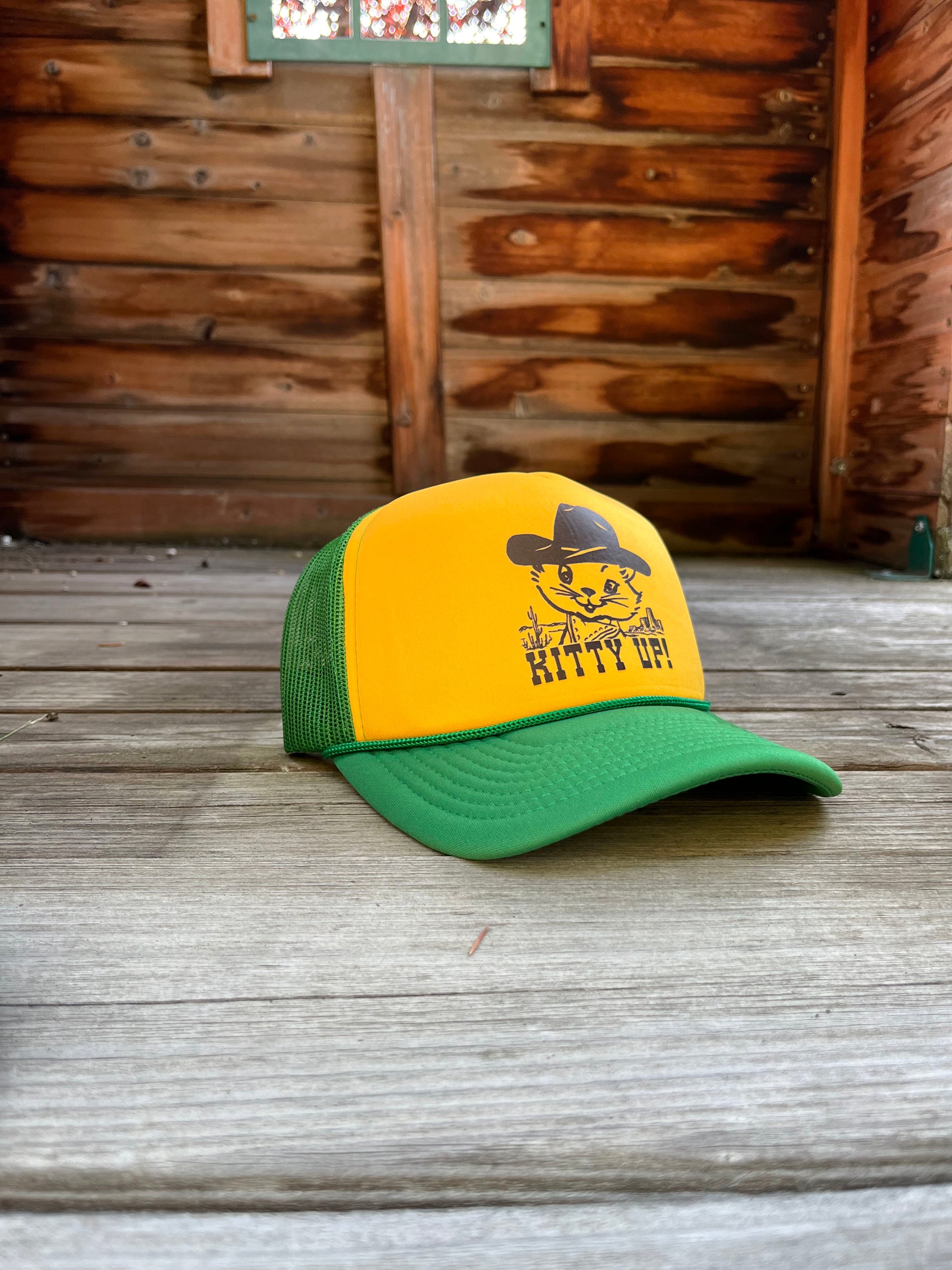 Yellow and green cap with a cat graphic and 'Kitty Up!' text