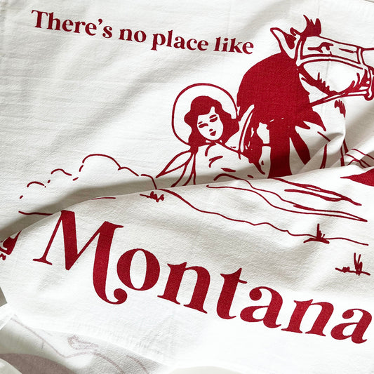 dish towel cowgirl riding horse mountains there's no place like Montana cotton kitchen towel screen print red ink coin laundry montana 