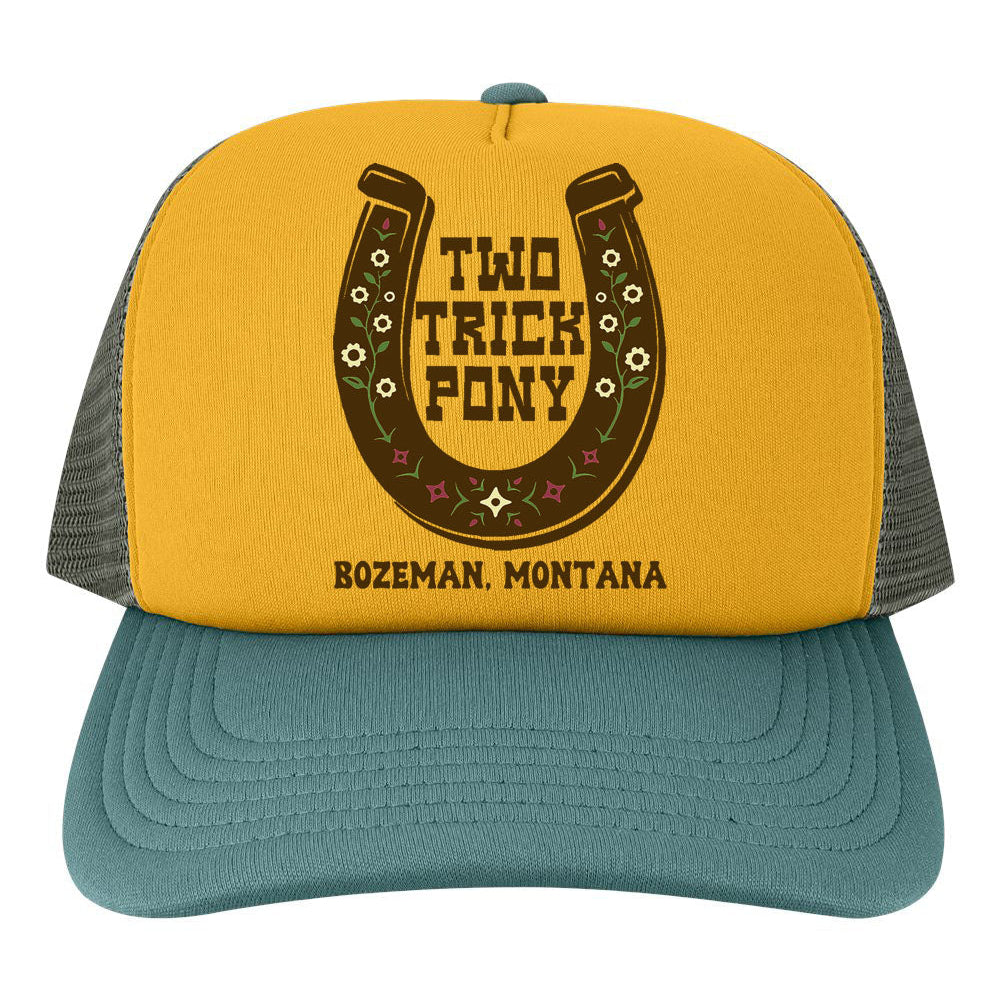 Yellow and blue trucker hat with 'Two Trick Pony' logo and text on a white background