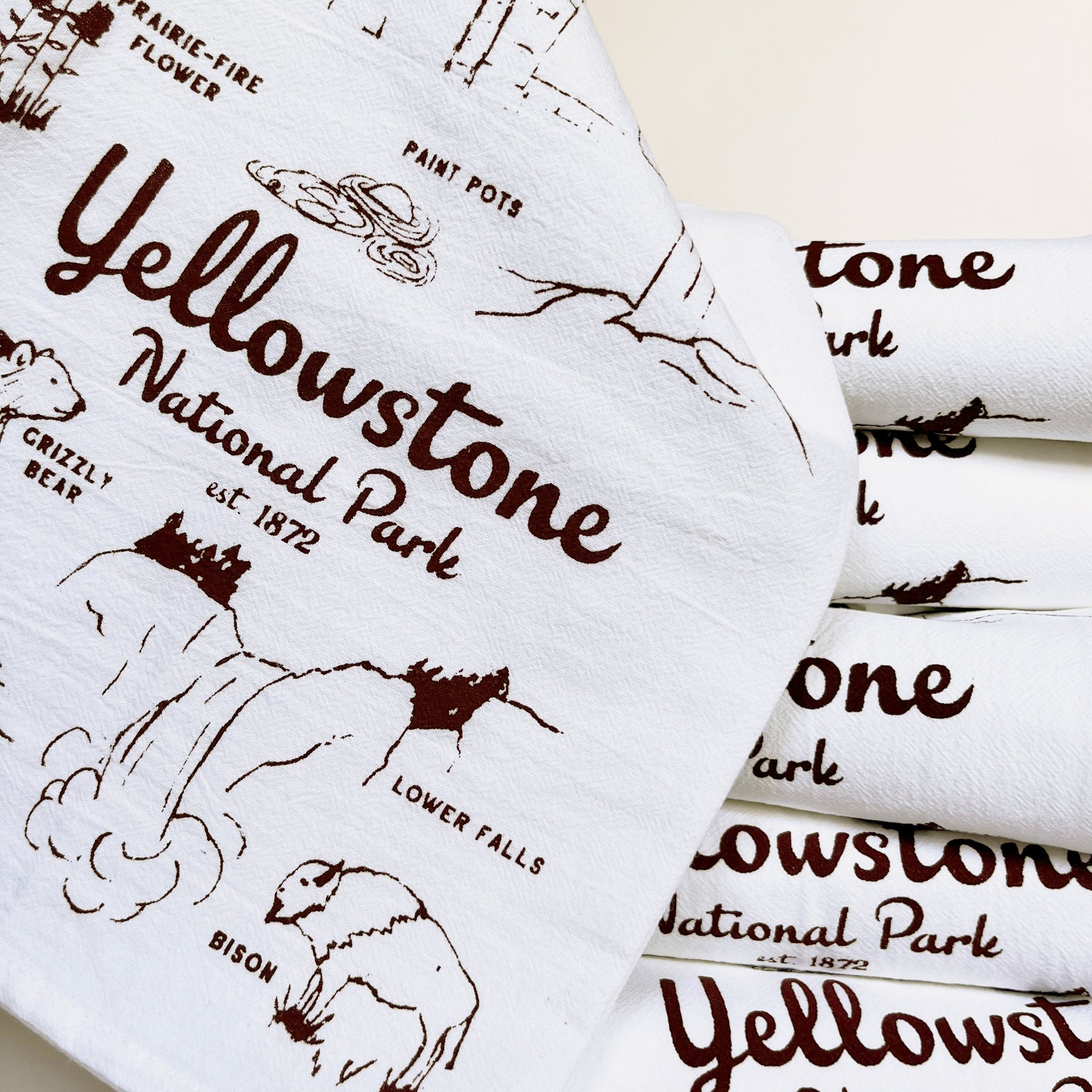 cotton dish towel yellowstone national park screen print brown ink hand drawn illustrations of bear bison waterfalls old faithful flowers Roosevelt arch souvenir tea towel fun screen print towels coin laundry montana  